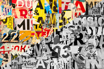 Collage of many numbers and letters ripped torn advertisement street posters grunge creased crumpled paper texture background placard backdrop surface