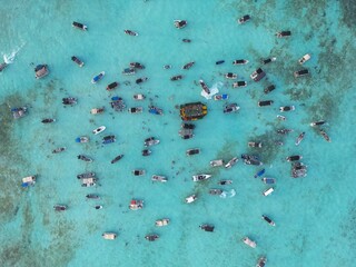 Heavily boat crowded marine area in San Andres Island. This spot is known as white water due to the tourquoise color of the water given from the sandy seabottom