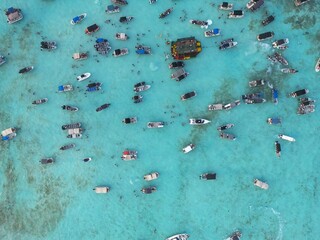 Heavily boat crowded marine area in San Andres Island. This spot is known as white water due to the tourquoise color of the water given from the sandy seabottom