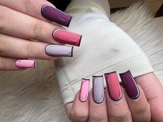 Female hands with pop art style manicure. Creative nail art design.