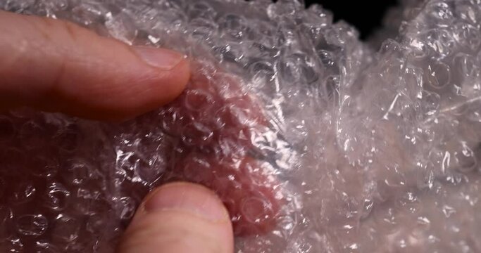 old air cellophane with a lot of bubbles for safe storage of things, close-up of a protective film with air bubbles