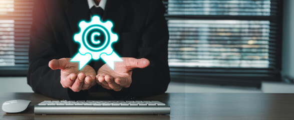 Copyright or patent concept, Businessman hands holding Copyright or patent icon on virtual screen, Author rights and patented intellectual property. copyleft trademark license.
