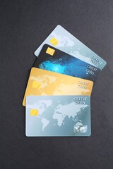 Many credit cards on grey table, flat lay