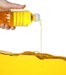 Woman pouring cooking oil from bottle on white background, closeup