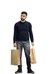 A man, full-length, on a white background, with bags