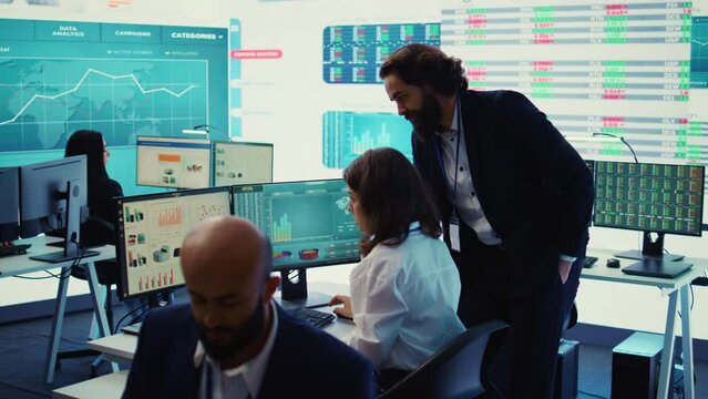 Chief executive officer supervising accounting activity to evaluate the financial operations correctly, ensuring resource allocation. General director working closely with an assistant. Camera B.