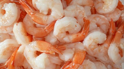 Frozen shrimp: harvested from sea, processed, frozen for freshness. Popular seafood globally for mild flavor, cooking versatility, quick cooking time. Food concept. Seafood background. 
