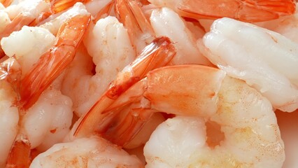 Frozen shrimp: translucent, glossy, slightly opaque due to freezing. Often pre-peeled, deveined for convenience, some varieties retain shells. Food concept. Seafood background. 
