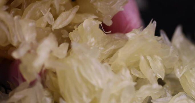 peeled pomelo on the table, cooking with ripe yellow pomelo