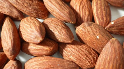 Prunus dulcis seeds, commonly known as almonds, boast a bounty of vitamin E, magnesium, and heart-healthy fats, crafting a nutritious snack.
