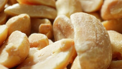 Dive into the intricate world of roasted peanuts with this macro shot. Each half reveals a golden-brown hue, inviting you to explore the delicate textures that make these nuts so irresistible.
