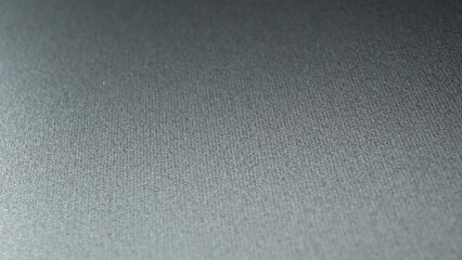 The subtle elegance of a metal surface, where the light plays gently across its finely textured expanse. The smooth, almost velvety appearance creates a sense of refined sophistication.
