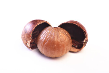 Close-up of a peeled sweet chestnut placed on a white background.    