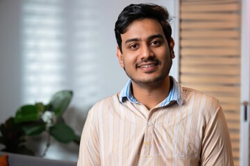 indian man, portrait of a young male, happy guy smiling, home sweet home 