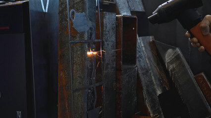 Laser removes rust on metal. Media. Hand gun with laser removes rust on metal. Laser with beam...