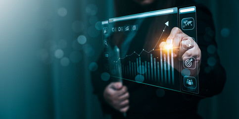 Businessman using laptop and analyzing economic growth, financial graph and business investment. planning strategy, stock market statistics, stock market trends, technical analysis strategy, value