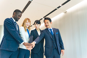 A group of multinational business people standing in a circle
