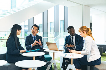 Group of multinational business people talking in a lobby