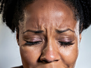 Obraz premium portrait of a crying woman, sad girl, portrait of a black woman, curly hair