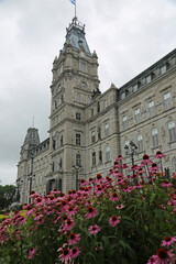Fototapeta premium Flowers and Parliament vertical - Quebec City, Canada