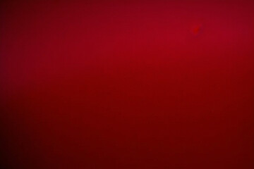 Dark and light red wall grunge backdrop texture. watercolor painted mottled red background, modern colorful concrete dirty smooth ink textures on black paper background