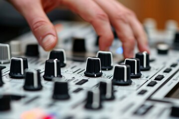 Closeup of DJ playing music at a mixer