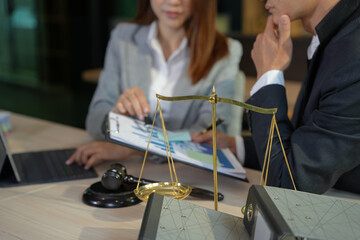 Partner lawyers or attorneys discussing a contract agreement. Successful businessmen have a contract in place to protect it,signing of modest agreements form in office...