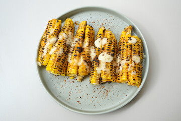 Roasted corn with barbecue sauce and mozzarella cheese
