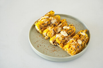 Roasted corn with barbecue sauce and mozzarella cheese

