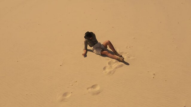Exhausted Dehydrated Traveler Woman Lost in the Desert