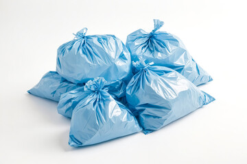 Fototapeta premium Close-up of Blue Plastic Garbage Bags on White Background