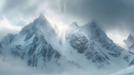 Sunlight shining on snow covered mountain peaks