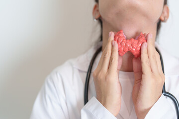 Doctor with human Thyroid anatomy model. Hyperthyroidism, Hypothyroidism, Hashimoto Thyroiditis,...