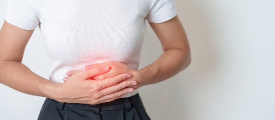 Woman having Stomach pain. Ovarian and Cervical cancer, Cervix disorder, Endometriosis, Hysterectomy, Uterine fibroids, Reproductive system, menstruation, diarrhea, digestive system and Pregnancy