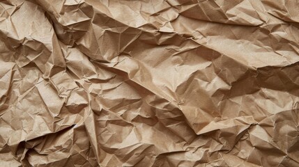 A macro photograph of crumpled and creased brown paper with visible fibers.