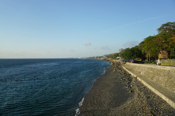 Sunny morning at sunrise on a beach.
