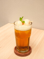 Lychee iced tea with mint leaves
