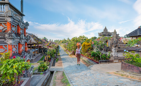 Balinese women carrying on religious offering - Penglipuran is a traditional oldest Bali village at Bangli Regency - Bali, Indonesia
