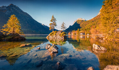 Rotpalfen peak reflected in the calm waters of Hintersee lake. Majestic autumn view of Bavarian Alps, Germany, Europe. Beauty of nature concept background.