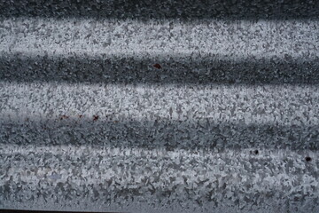 photo of the corrugated zinc texture in silver metal, Corrugated metal texture surface background.