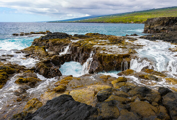 Waves Crashing Over The Volcanic Shoreline  at Hokulia Shoreline Park, Hawaii Island, Hawaii, USA