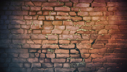 Weathered and cracked brick wall in close-up