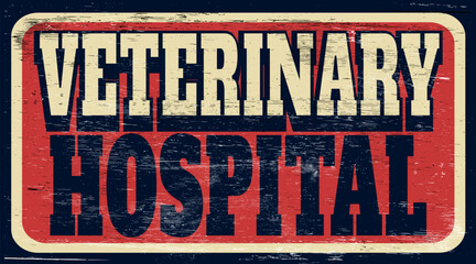 Fototapeta premium Aged and worn veterinary hospital sign on wood