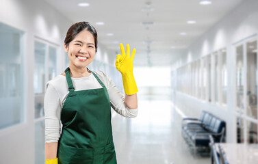 Asian housekeeper wear gloves apron