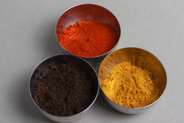 Red Chili powder, turmeric powder and spice powder in bowl. Indian Masala in bowl. 