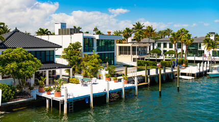 Fototapeta premium Vacation in summer paradise. Luxury resort at summertime. Travel to tropical bay of Florida. Summer vacation in tropical paradise resort. Luxury summer villa with yacht pier. Luxurious escape