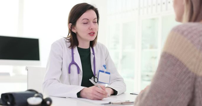 Consultation between doctor and patient in clinic