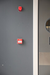 Red fire alarm button on wall ,