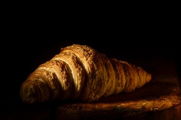 photography of croissant or crescent made of butter and puff pastry in low key