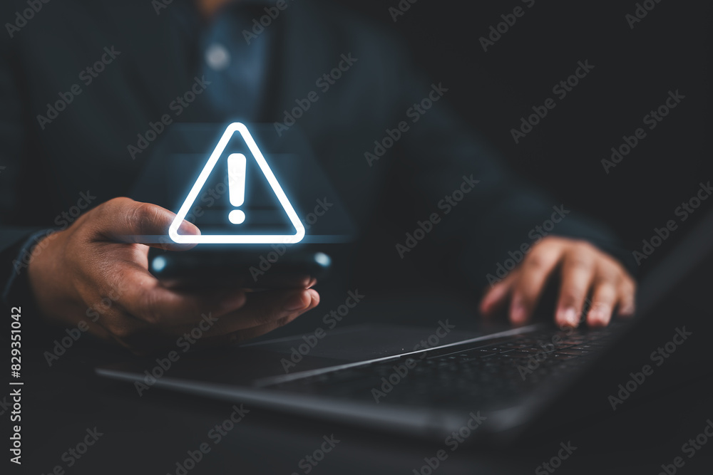 Poster Maintenance concept. Businessman using smartphone with triangle caution warning sign for notification error. System failure and security issues.